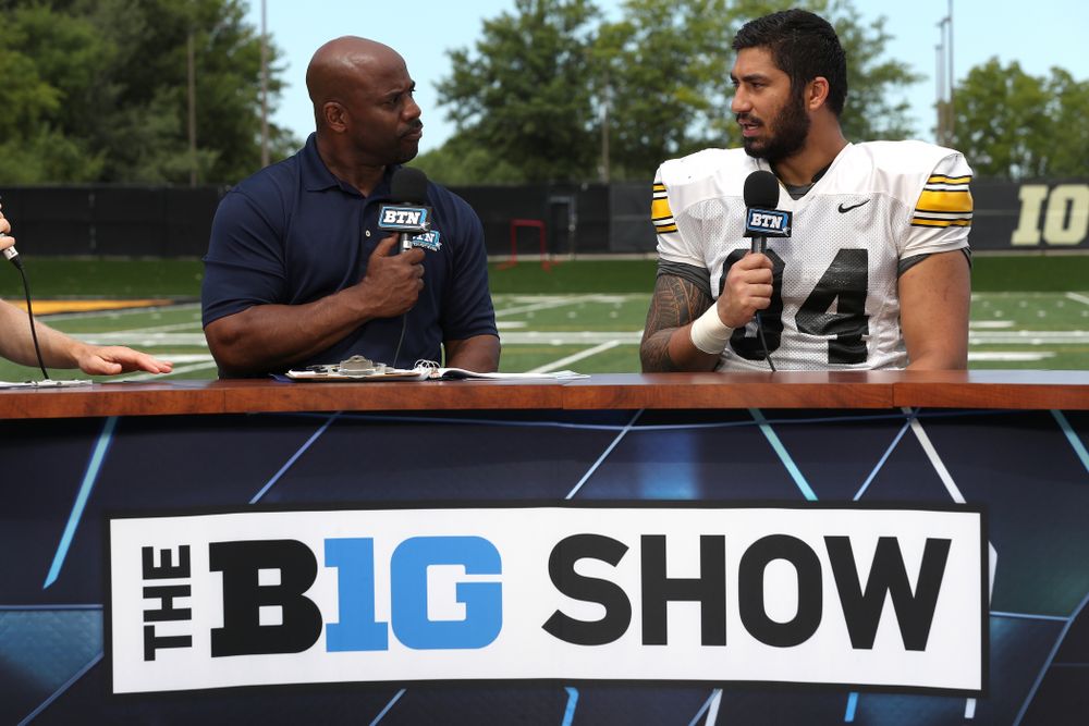 Iowa Hawkeyes defensive end A.J. Epenesa (94) and defensive back Michael Ojemudia (11) on the set of the BTN Tailgate Tour following fall camp Practice No. 16 Tuesday, August 20, 2019 at the Ronald D. and Margaret L. Kenyon Football Practice Facility. (Brian Ray/hawkeyesports.com)