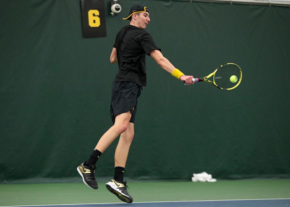 Iowa’s Nikita Snezhko returns a shot during his singles match at the Hawkeye Tennis and Recreation Complex in Iowa City on Friday, March 6, 2020. (Stephen Mally/hawkeyesports.com)