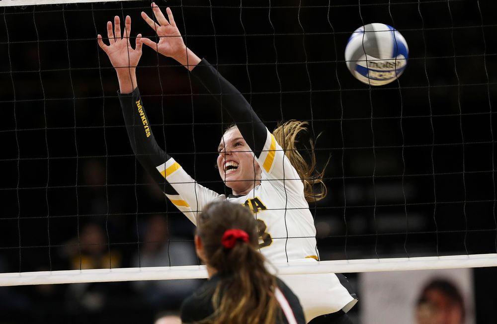 Iowa Hawkeyes middle blocker Hannah Clayton (18) goes up for a block during a match against Nebraska at Carver-Hawkeye Arena on November 7, 2018. (Tork Mason/hawkeyesports.com)