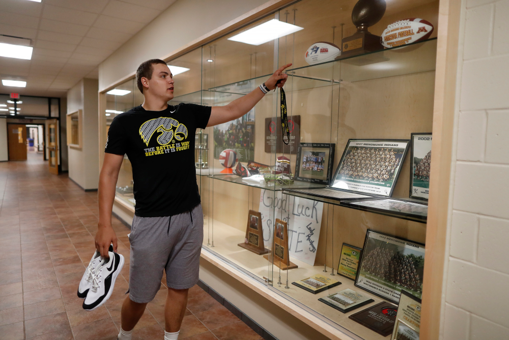 Iowa Hawkeyes quarterback Nathan Stanley (4) looks over the trophy case at his high school Wednesday, May 30, 2018 in Menomonie, Wisc. (Brian Ray/hawkeyesports.com)