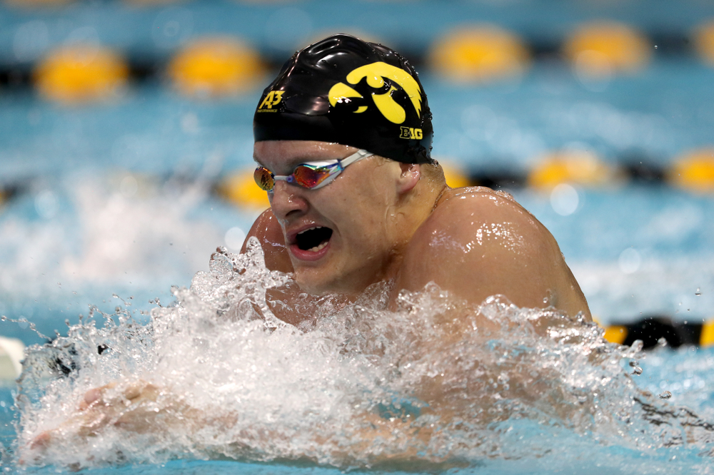 IowaÕs Will Myhre competes in the 100 yard breaststroke against Notre Dame and Illinois Saturday, January 11, 2020 at the Campus Recreation and Wellness Center. (Brian Ray/hawkeyesports.com)