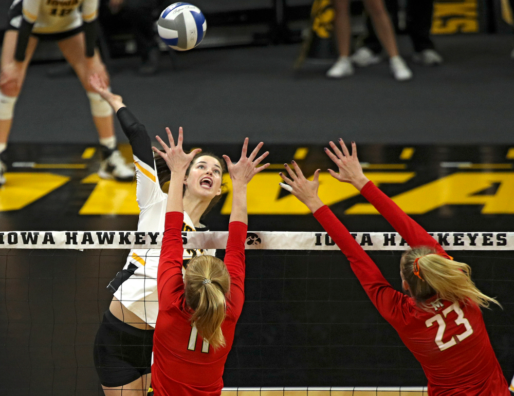 Iowa’s Courtney Buzzerio (2) gets up for a kill during the first set of their match at Carver-Hawkeye Arena in Iowa City on Saturday, Nov 30, 2019. (Stephen Mally/hawkeyesports.com)
