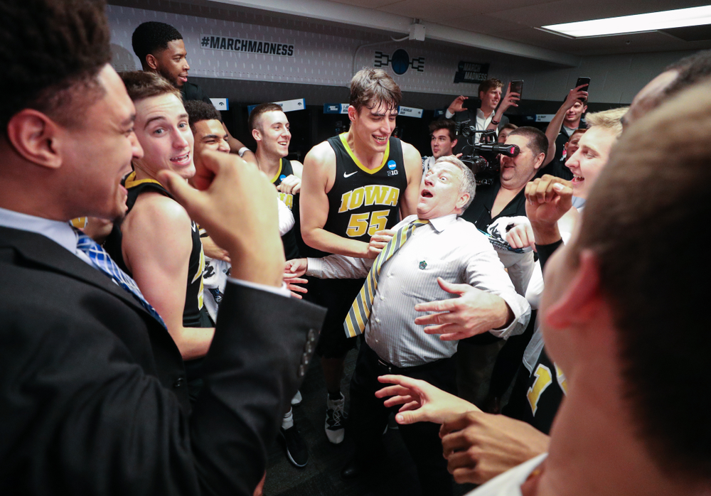 Iowa Hawkeyes assistant coach Kirk Speraw dances with the team following their win against the Cincinnati Bearcats in the first round of the 2019 NCAA Men's Basketball Tournament Friday, March 22, 2019 at Nationwide Arena in Columbus, Ohio. (Brian Ray/hawkeyesports.com)
