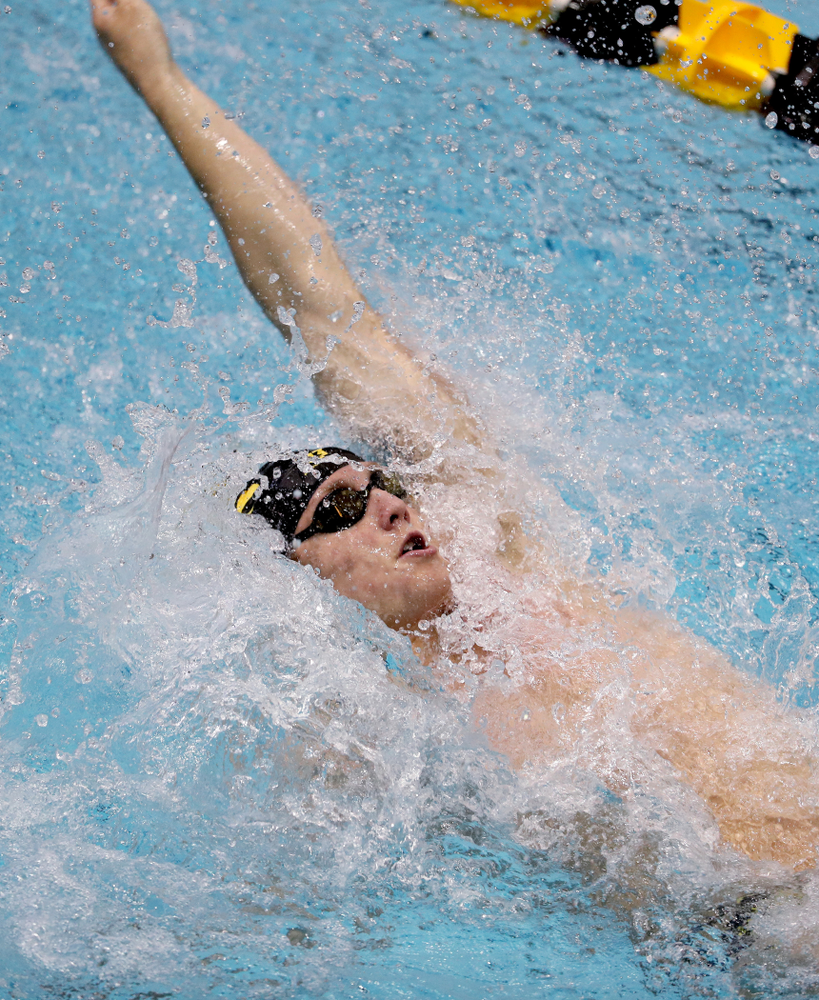 IowaÕs Ryan Purdy competes in the 100 yard backstroke against Notre Dame and Illinois Saturday, January 11, 2020 at the Campus Recreation and Wellness Center. (Brian Ray/hawkeyesports.com)