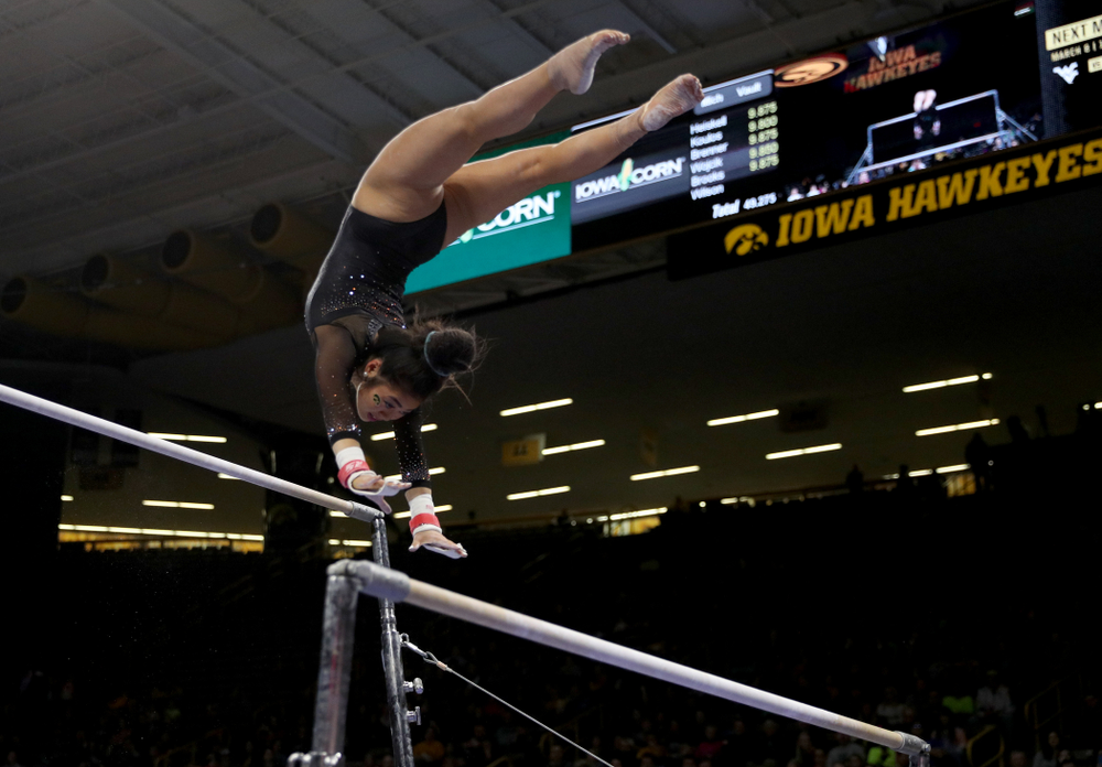 Iowa’s Clair Kaji competes on the bars against Michigan Friday, February 14, 2020 at Carver-Hawkeye Arena. (Brian Ray/hawkeyesports.com)