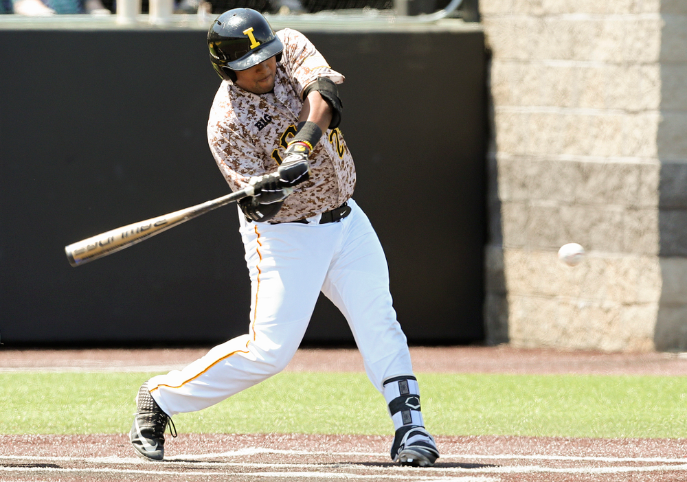 Iowa Hawkeyes first baseman Izaya Fullard (20) drives a pitch for a hit during the first inning of their game against UC Irvine at Duane Banks Field in Iowa City on Sunday, May. 5, 2019. (Stephen Mally/hawkeyesports.com)