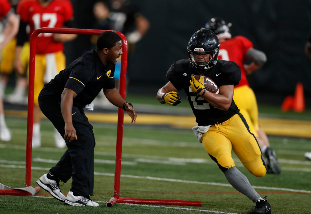 Iowa Hawkeyes running back Ivory Kelly-Martin (21) and running backs coach Derrick Foster during spring practice Wednesday, March 28, 2018 at the Hansen Football Performance Center. (Brian Ray/hawkeyesports.com)