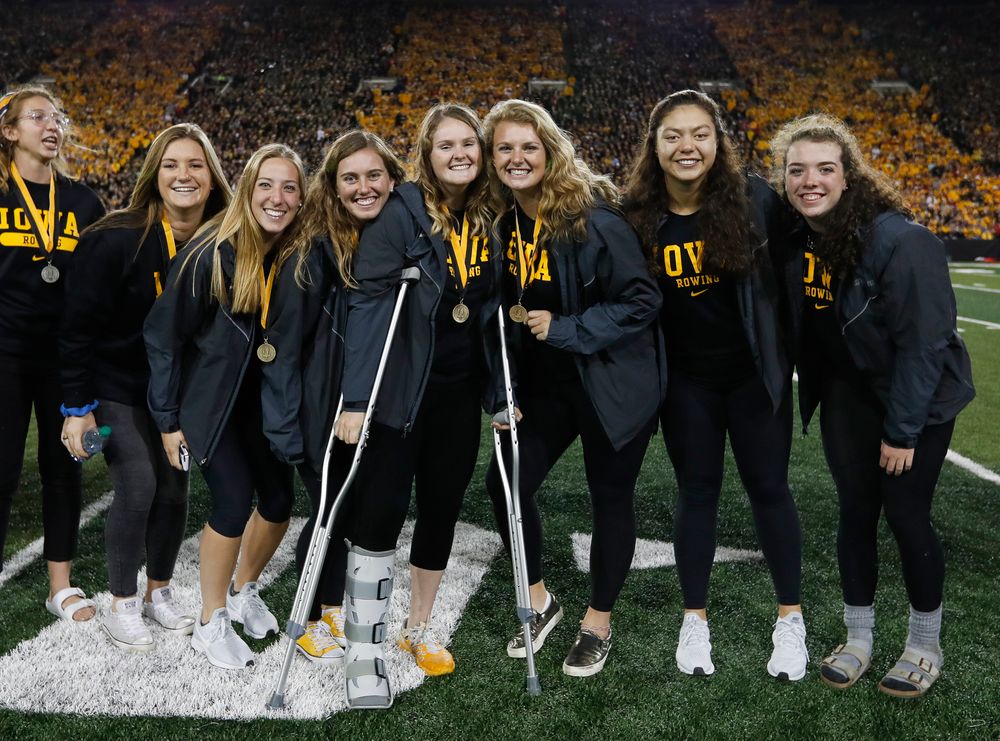 Members of the Iowa rowing team are recognized by the Presidential Committee on Athletics at halftime during a game against Wisconsin on September 22, 2018. (Tork Mason/hawkeyesports.com)
