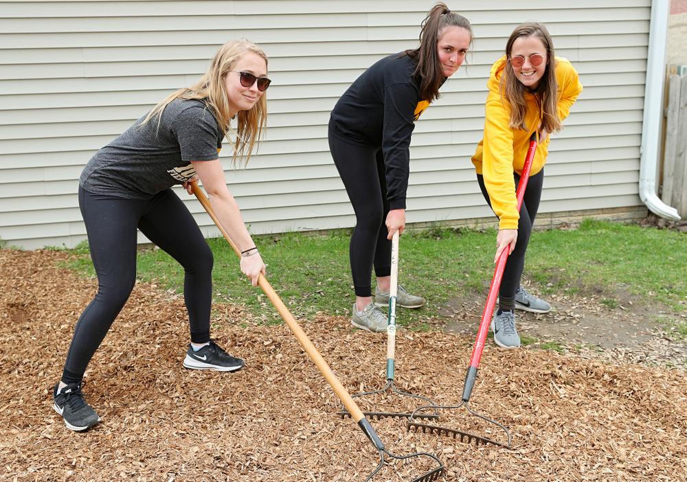 Iowa field hockey players re-mulch the playground at the HACAP Coral Ridge Head Start Center during the 21st annual ISAAC Hawkeye Day of Caring in Coralville on Sunday, Apr. 28, 2019. (Stephen Mally/hawkeyesports.com)