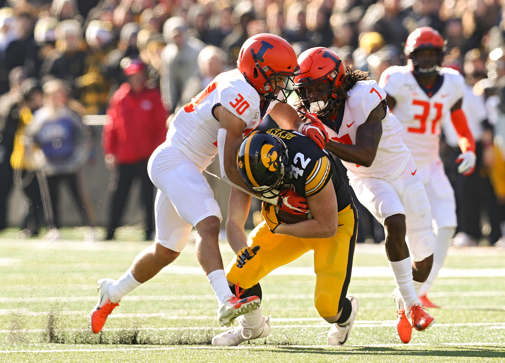 Iowa Hawkeyes tight end Shaun Beyer (42) pulls defenders with him after pulling in a pass during the second quarter of their game at Kinnick Stadium in Iowa City on Saturday, Nov 23, 2019. (Stephen Mally/hawkeyesports.com)