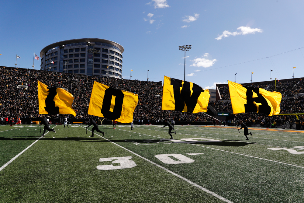 The Iowa Spirit Squad brings out the IOWA flags against the Maryland Terrapins Saturday, October 20, 2018 at Kinnick Stadium (Brian Ray/hawkeyesports.com)