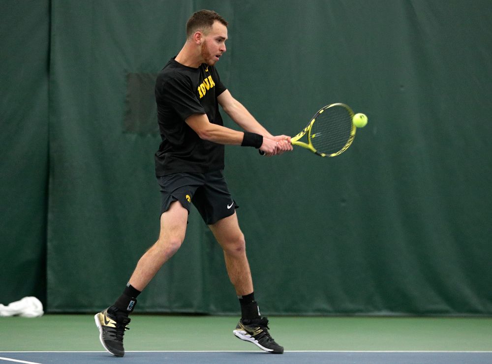 Iowa’s Kareem Allaf returns a shot during his singles match at the Hawkeye Tennis and Recreation Complex in Iowa City on Friday, March 6, 2020. (Stephen Mally/hawkeyesports.com)