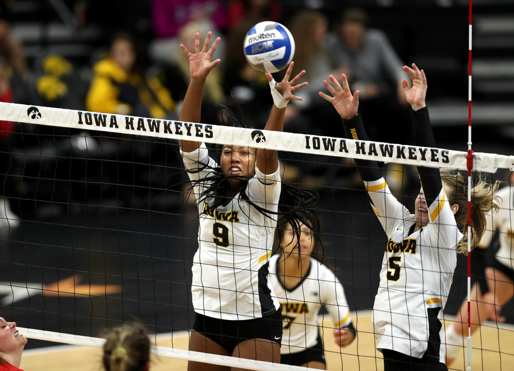 Iowa Hawkeyes middle blocker Amiya Jones (9) and outside hitter Meghan Buzzerio (5) against the Ohio State Buckeyes Saturday, November 24, 2018 at Carver-Hawkeye Arena. (Brian Ray/hawkeyesports.com)