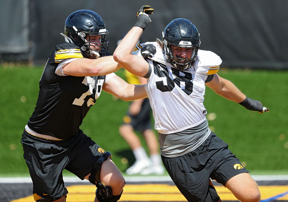 Iowa Hawkeyes defensive lineman Chris Reames (98) tries to ger around offensive lineman Jack Plumb (79) during Fall Camp Practice No. 7 at the Hansen Football Performance Center in Iowa City on Friday, Aug 9, 2019. (Stephen Mally/hawkeyesports.com)