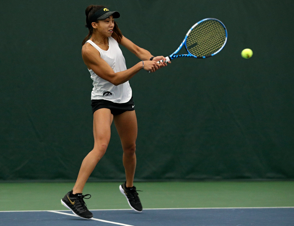 Iowa’s Michelle Bacalla returns a shot during her doubles match at the Hawkeye Tennis and Recreation Complex in Iowa City on Sunday, February 23, 2020. (Stephen Mally/hawkeyesports.com)