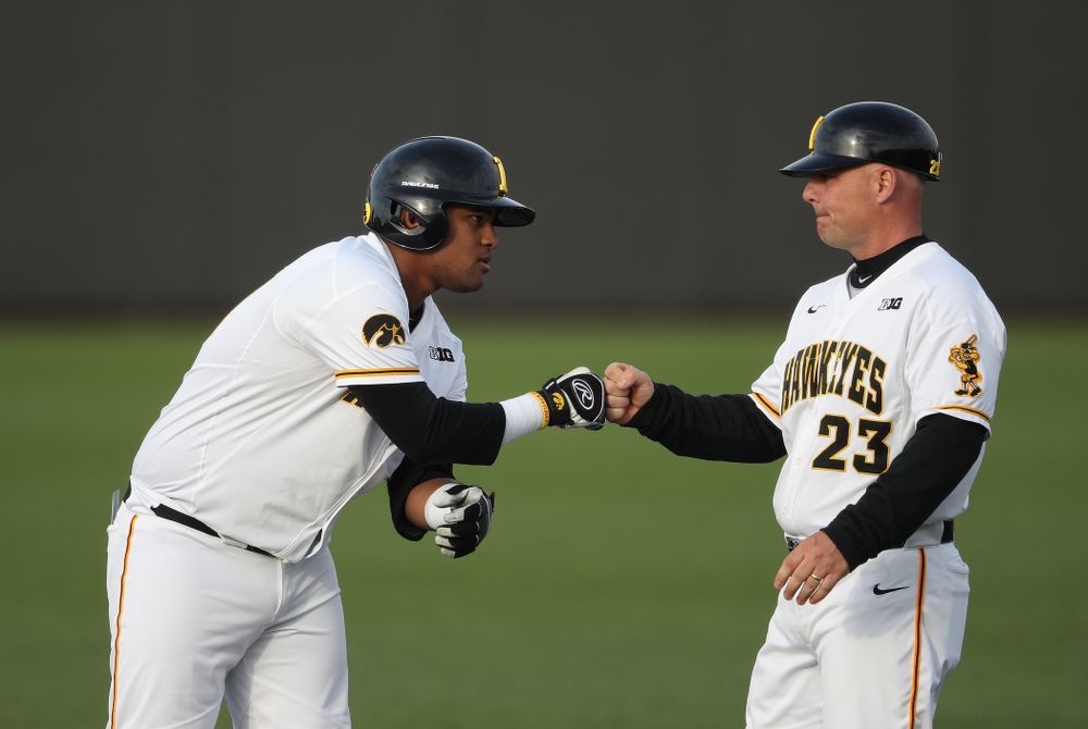 Iowa Hawkeyes Izaya Fullard (20) and assistant coach Robin Lund during game one against UC Irvine Friday, May 3, 2019 at Duane Banks Field. (Brian Ray/hawkeyesports.com)