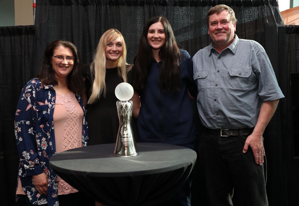 Iowa Hawkeyes forward Megan Gustafson (10) poses for photo with her family Eva, Clendon, and Emily after winning the Associated Press Player Of The Year during a news conference Thursday, April 4, 2019 at Amalie Arena in Tampa, FL. (Brian Ray/hawkeyesports.com)
