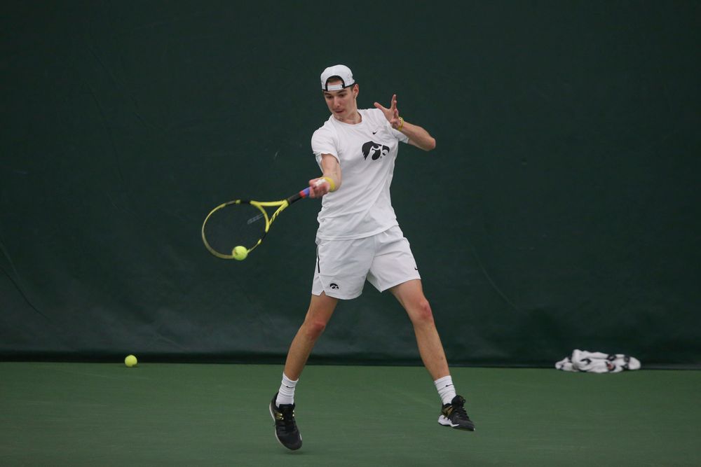 Iowa’s Nikita Snezhko returns a hit during the Iowa men’s tennis meet vs Nebraska on Sunday, March 1, 2020 at the Hawkeye Tennis and Recreation Complex. (Lily Smith/hawkeyesports.com)