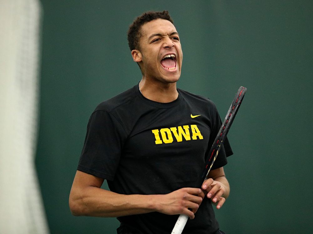 Iowa’s Oliver Okonkwo celebrates a point during his singles match at the Hawkeye Tennis and Recreation Complex in Iowa City on Friday, March 6, 2020. (Stephen Mally/hawkeyesports.com)