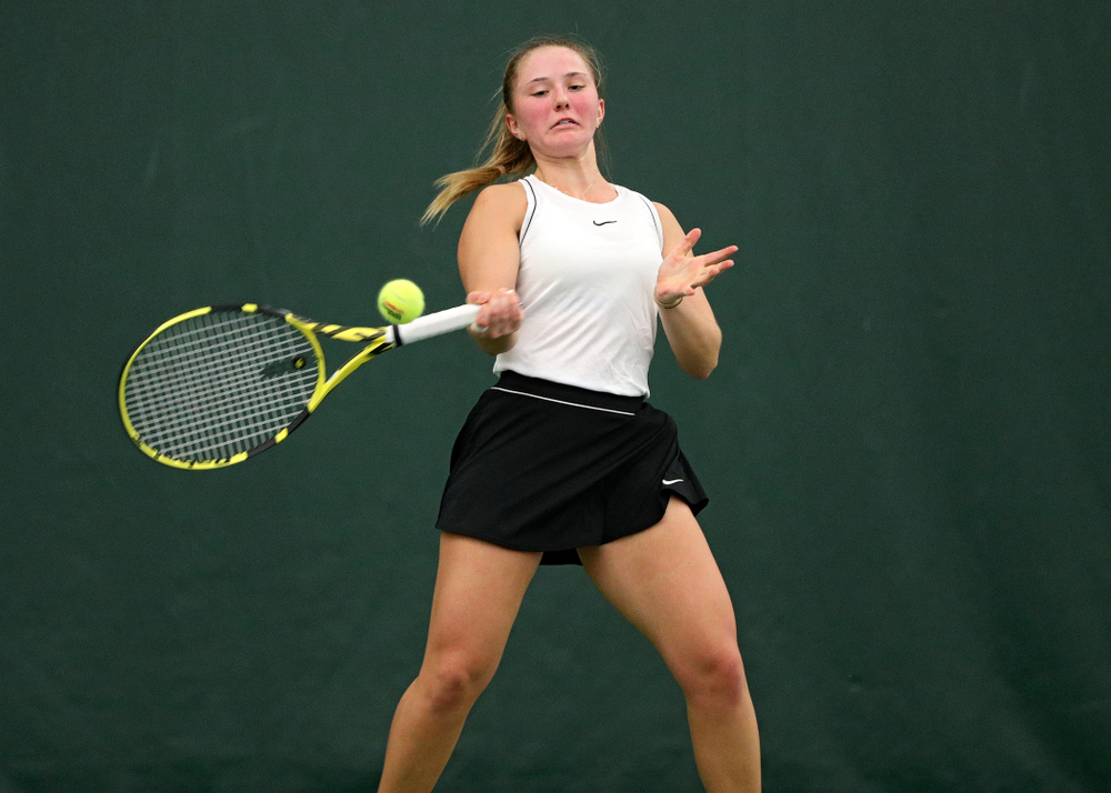 Iowa’s Danielle Burich returns a shot during her singles match at the Hawkeye Tennis and Recreation Complex in Iowa City on Sunday, February 16, 2020. (Stephen Mally/hawkeyesports.com)