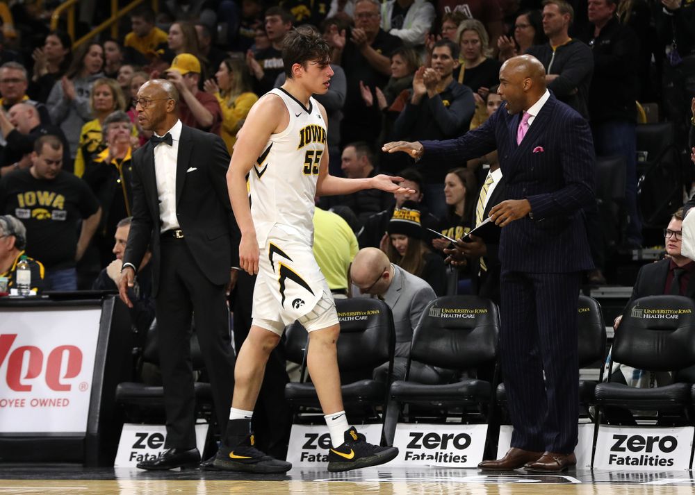 Iowa Hawkeyes forward Luka Garza (55) and assistant coach Andrew Francis against the Michigan Wolverines Friday, February 1, 2019 at Carver-Hawkeye Arena. (Brian Ray/hawkeyesports.com)