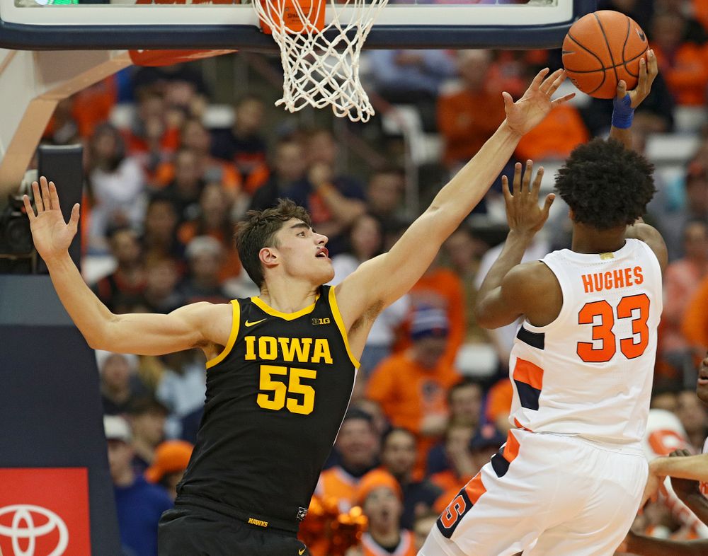 Iowa Hawkeyes center Luka Garza (55) blocks a shot by Syracuse Orange forward Elijah Hughes (33) during the second half of their ACC/Big Ten Challenge game at the Carrier Dome in Syracuse, N.Y. on Tuesday, Dec 3, 2019. (Stephen Mally/hawkeyesports.com)
