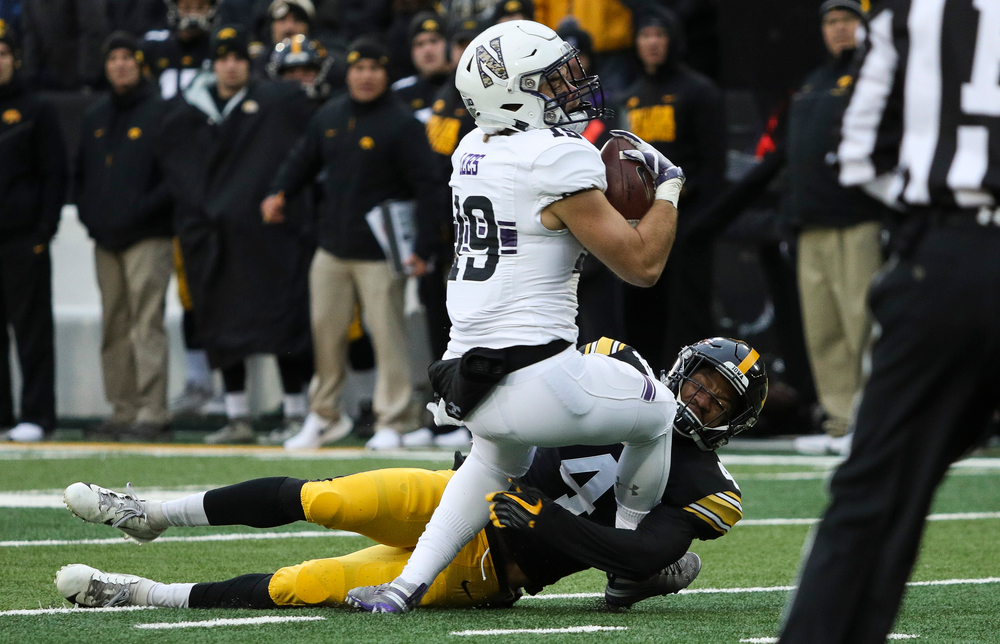 Iowa Hawkeyes defensive back Josh Turner (4) makes a tackle during a game against Northwestern at Kinnick Stadium on November 10, 2018. (Tork Mason/hawkeyesports.com)