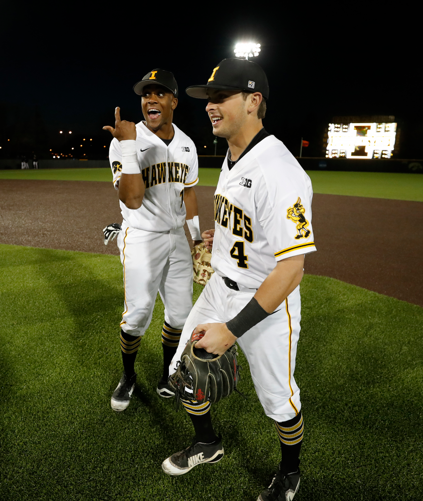 Iowa Hawkeyes third baseman Lorenzo Elion (1) and infielder Mitchell Boe (4) against the Michigan Wolverines Friday, April 27, 2018 at Duane Banks Field in Iowa City. (Brian Ray/hawkeyesports.com)