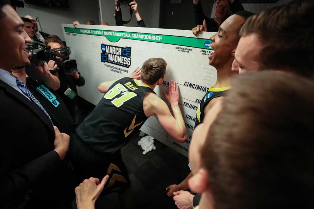 Iowa Hawkeyes forward Nicholas Baer (51) advances the team on the bracket following their game against the Cincinnati Bearcats in the first round of the 2019 NCAA Men's Basketball Tournament Friday, March 22, 2019 at Nationwide Arena in Columbus, Ohio. (Brian Ray/hawkeyesports.com)