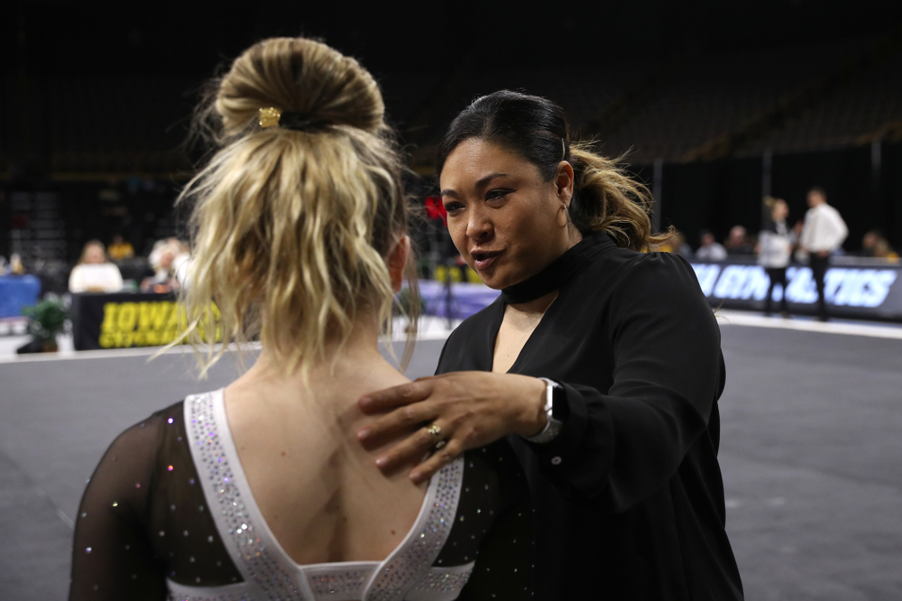 Iowa head coach Larissa Libby talks with Charlotte Sullivan before her routine on the floor during their meet against the Rutgers Scarlet Knights Saturday, January 26, 2019 at Carver-Hawkeye Arena. (Brian Ray/hawkeyesports.com)