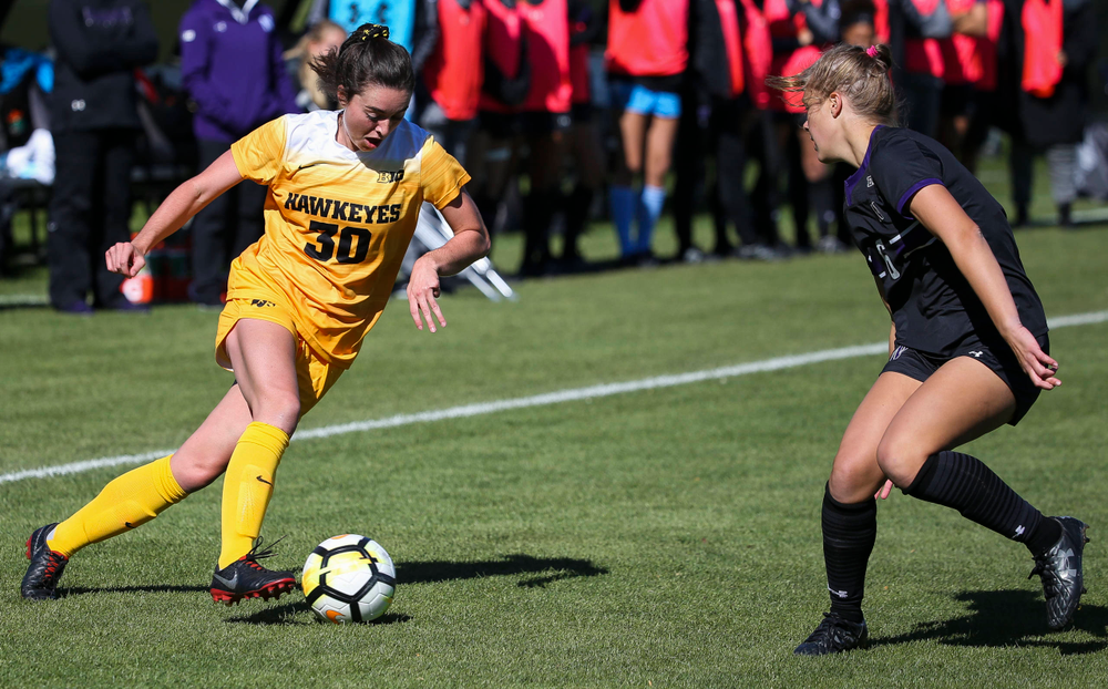 Iowa Hawkeyes forward Devin Burns (30) dribbles the ball during a game against Northwestern at the Iowa Soccer Complex on October 21, 2018. (Tork Mason/hawkeyesports.com)