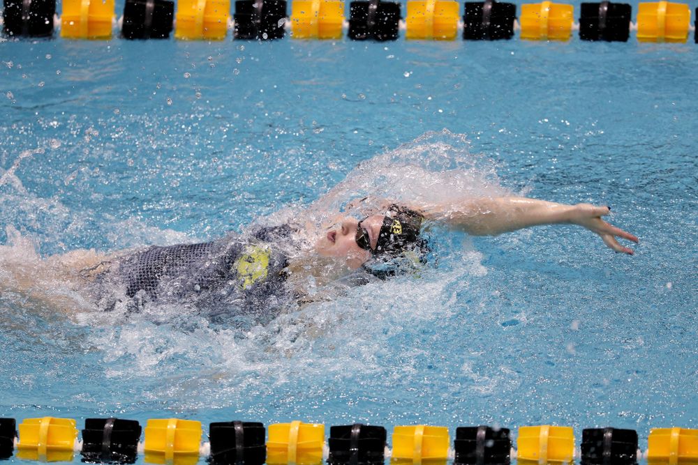 IowaÕs Emilia Sansome competes in the 100 yard backstroke against Notre Dame and Illinois Saturday, January 11, 2020 at the Campus Recreation and Wellness Center. (Brian Ray/hawkeyesports.com)
