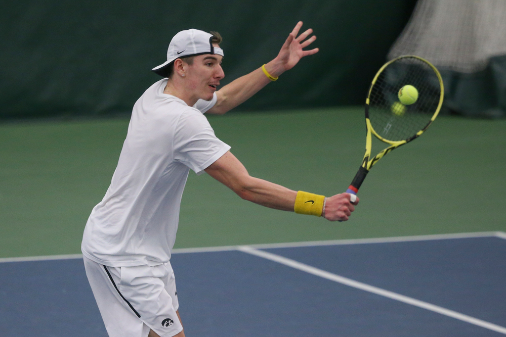 Iowa’s Nikita Snezhko returns a hit during the Iowa men’s tennis meet vs Nebraska on Sunday, March 1, 2020 at the Hawkeye Tennis and Recreation Complex. (Lily Smith/hawkeyesports.com)