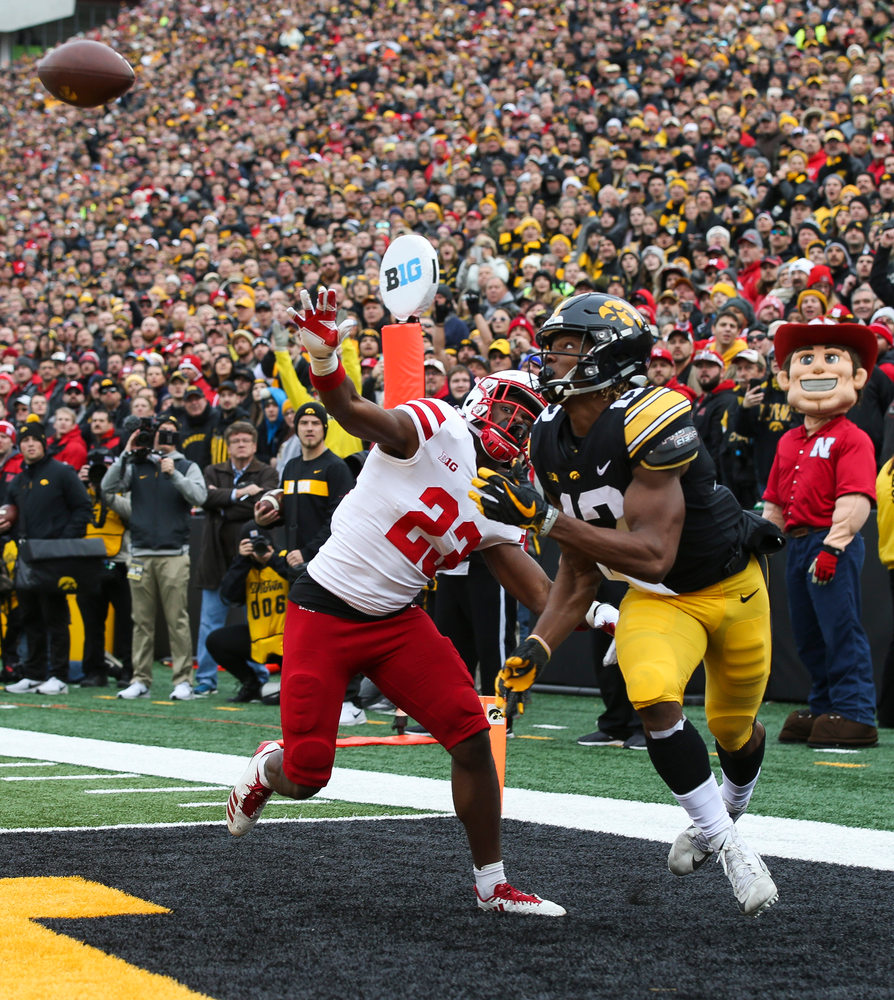 Iowa Hawkeyes wide receiver Brandon Smith (12) makes a touchdown catch during a game against Nebraska at Kinnick Stadium on November 23, 2018. (Tork Mason/hawkeyesports.com)