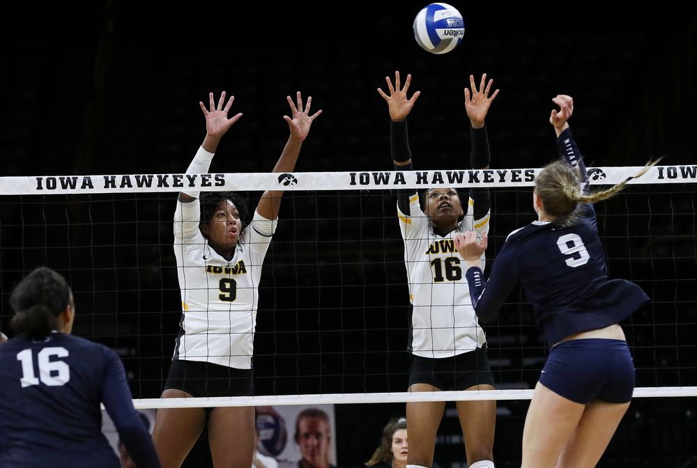 Iowa Hawkeyes middle blocker Amiya Jones (9) and Iowa Hawkeyes outside hitter Taylor Louis (16) go up for a block during a match against Penn State at Carver-Hawkeye Arena on November 3, 2018. (Tork Mason/hawkeyesports.com)