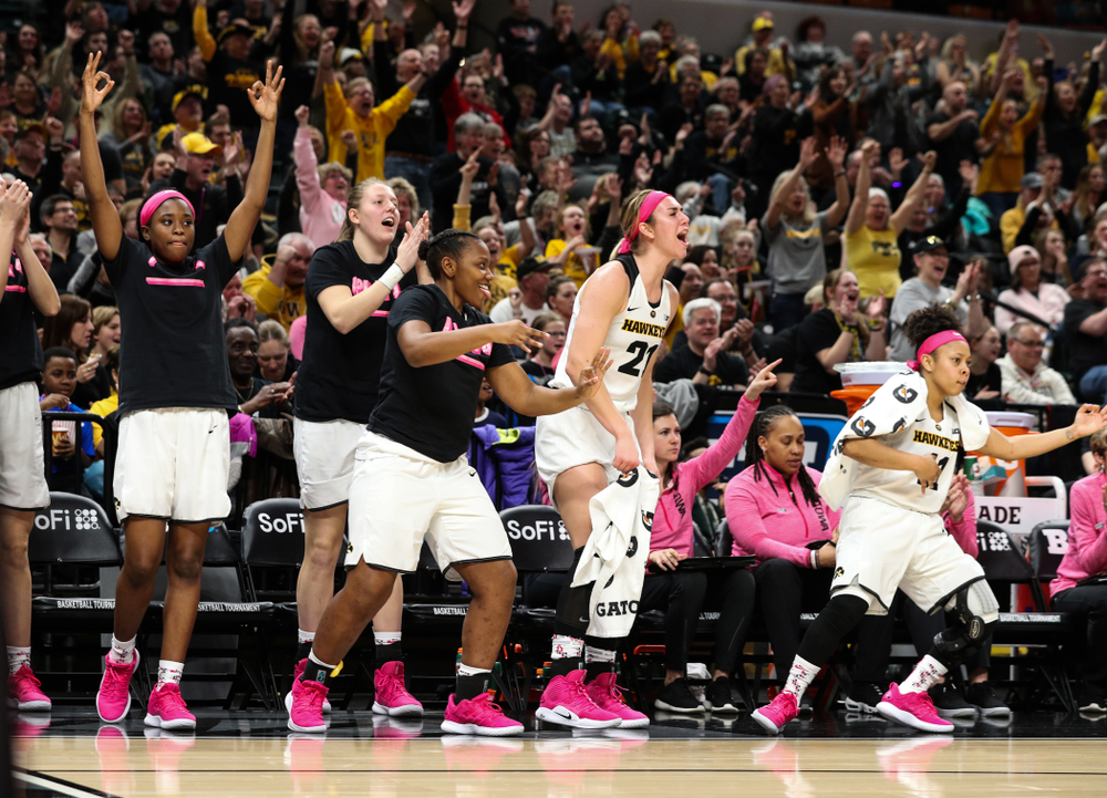 The Iowa Hawkeyes celebrate a three point basket by guard Kathleen Doyle (22) against the Rutgers Scarlet Knights in the semi-finals of the Big Ten Tournament Saturday, March 9, 2019 at Bankers Life Fieldhouse in Indianapolis, Ind. (Brian Ray/hawkeyesports.com)