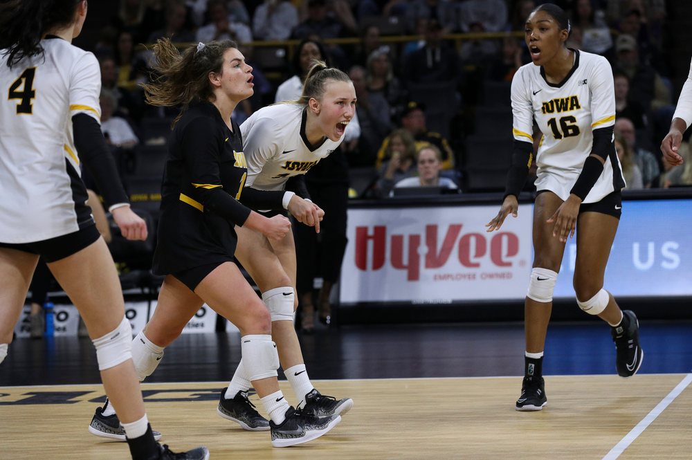 Iowa Hawkeyes defensive specialist Molly Kelly (1) and Iowa Hawkeyes outside hitter Cali Hoye (14) celebrate after winning a point during a match against Penn State at Carver-Hawkeye Arena on November 3, 2018. (Tork Mason/hawkeyesports.com)
