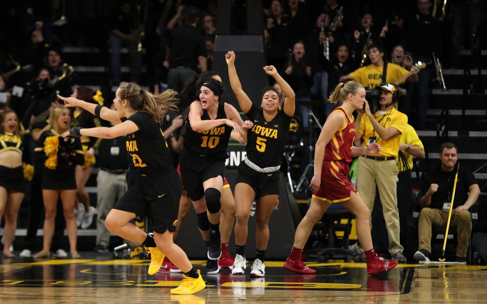 Iowa Hawkeyes forward Megan Gustafson (10) and guard Alexis Sevillian (5) celebrate their 73-70 win against the Iowa State Cyclones in the Iowa Corn Cy-Hawk Series Wednesday, December 5, 2018 at Carver-Hawkeye Arena. (Brian Ray/hawkeyesports.com)