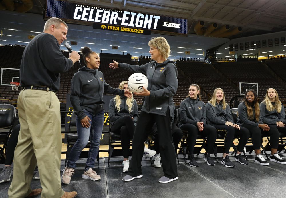 Iowa Hawkeyes head coach Lisa Bluder presents guard Tania Davis (11) with a ball commemorating her 1,00th point during the teamÕs Celebr-Eight event Wednesday, April 24, 2019 at Carver-Hawkeye Arena. (Brian Ray/hawkeyesports.com)