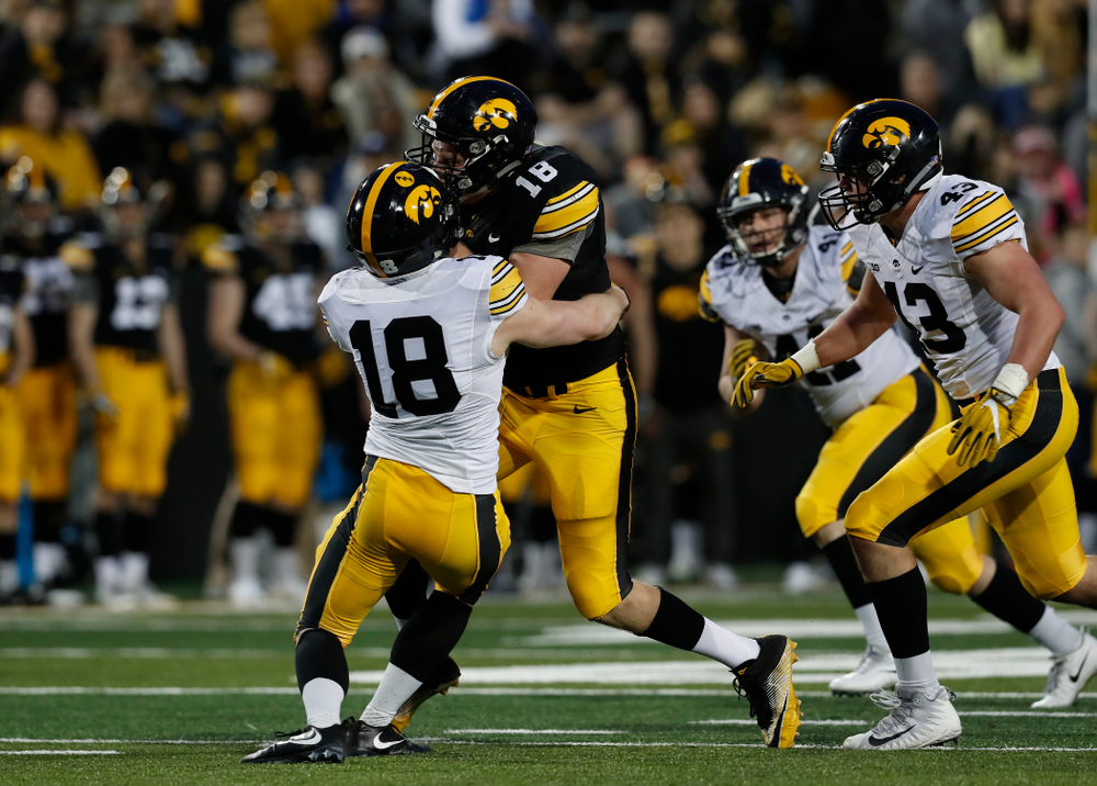 Iowa Hawkeyes tight end Drew Cook (18) and defensive back John Milani (18) during their final spring practice Friday, April 20, 2018 at Kinnick Stadium. (Brian Ray/hawkeyesports.com)