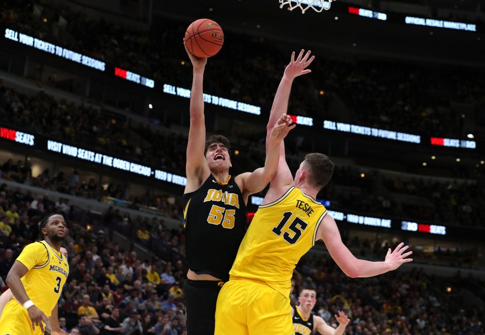 Iowa Hawkeyes forward Luka Garza (55) against the Michigan Wolverines in the 2019 Big Ten Men's Basketball Tournament Friday, March 15, 2019 at the United Center in Chicago. (Brian Ray/hawkeyesports.com)