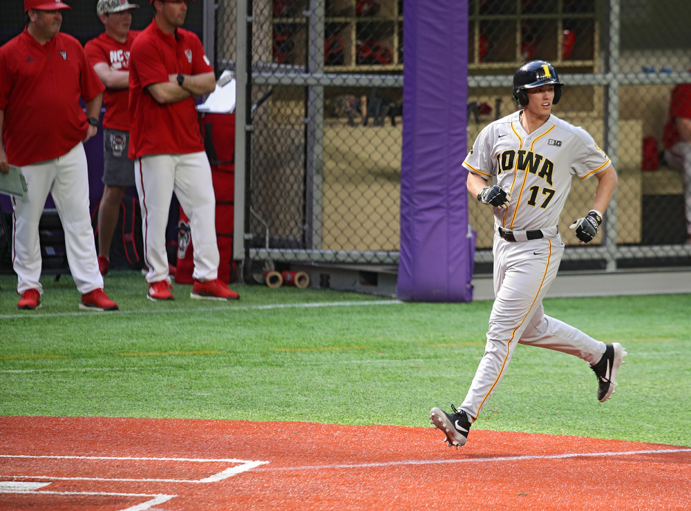 Iowa Hawkeyes infielder Dylan Nedved (17) scores a run during the seventh inning of their CambriaCollegeClassic game at U.S. Bank Stadium in Minneapolis, Minn. on Friday, February 28, 2020. (Stephen Mally/hawkeyesports.com)