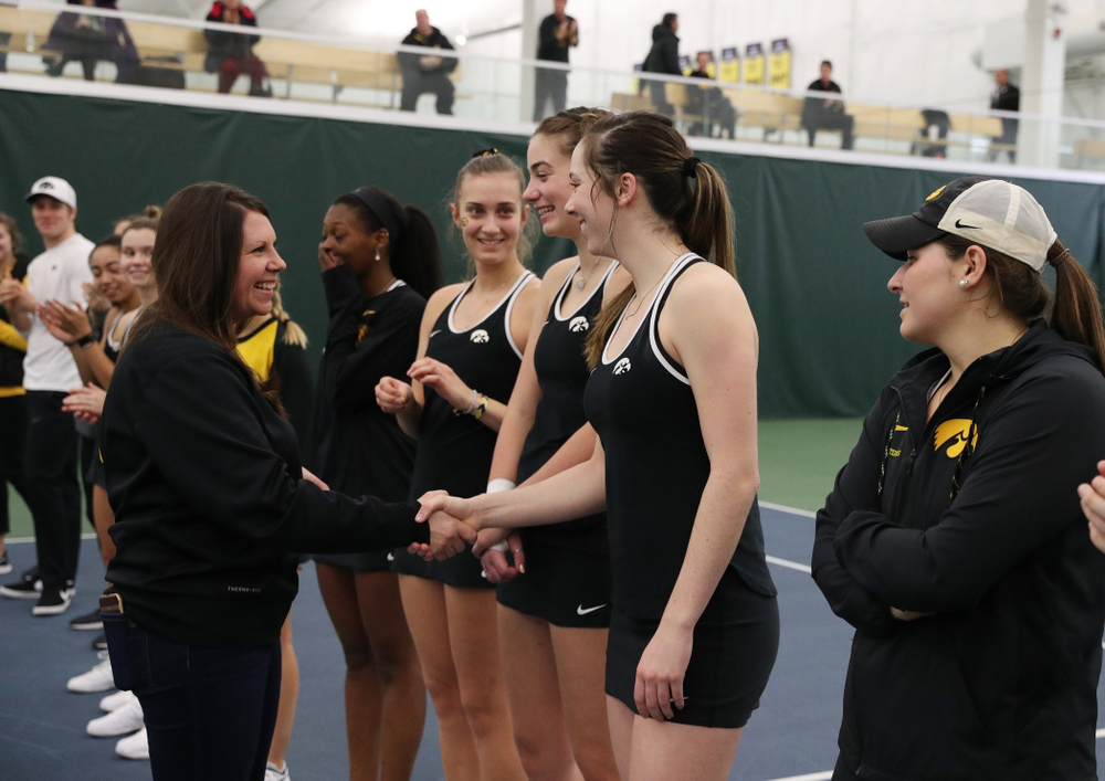 Academic Student Services Associate Director Kara Park congratulates Samantha Mannix for earning a 3.0 GPA or better during the fall semester before their match against the Penn State Nittany Lions Sunday, February 24, 2019 at the Hawkeye Tennis and Recreation Complex. (Brian Ray/hawkeyesports.com)