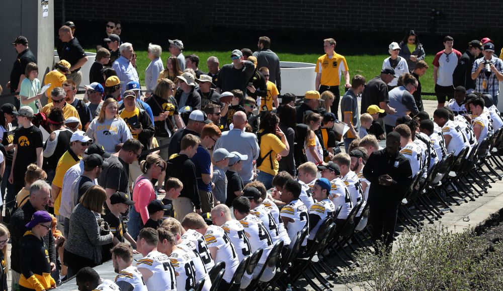 Members of the Iowa Football team sign autographs before the Iowa Hawkeyes game against the Nebraska Cornhuskers Saturday, April 20, 2019 at Duane Banks Field. (Brian Ray/hawkeyesports.com)