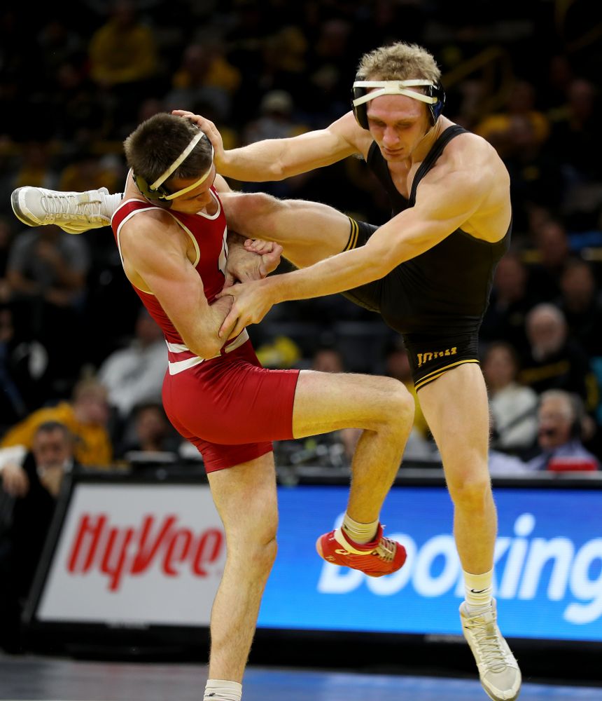 IowaÕs Kaleb Young wrestles WisconsinÕs Garrett Model at 157 pounds Sunday, December 1, 2019 at Carver-Hawkeye Arena. Young won the match 12-6. (Brian Ray/hawkeyesports.com)