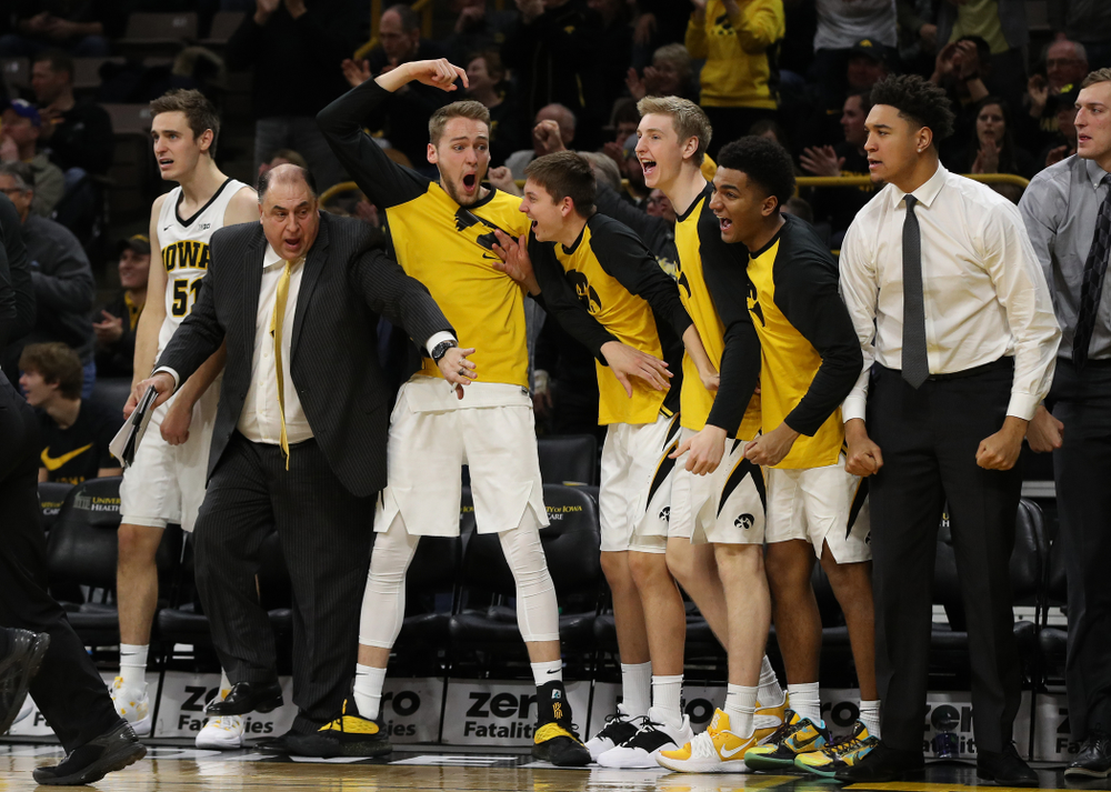 Iowa Hawkeyes forward Riley Till (20) reacts to a dunk by forward Tyler Cook (25) against the Ohio State Buckeyes Saturday, January 12, 2019 at Carver-Hawkeye Arena. (Brian Ray/hawkeyesports.com)