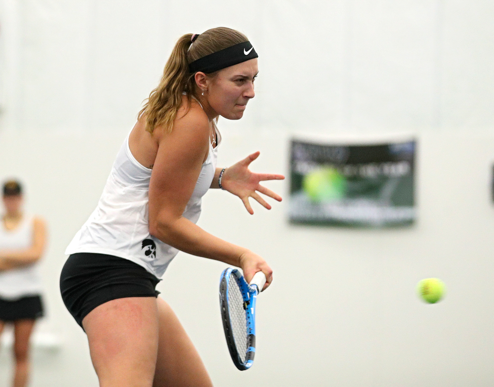 Iowa’s Ashleigh Jacobs returns a shot during her doubles match at the Hawkeye Tennis and Recreation Complex in Iowa City on Sunday, February 23, 2020. (Stephen Mally/hawkeyesports.com)