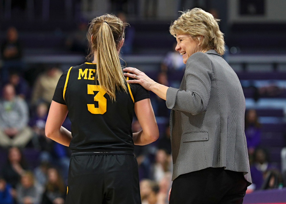 Iowa Hawkeyes guard Makenzie Meyer (3) shares a laugh with head coach Lisa Bluder during the third quarter of their game at Welsh-Ryan Arena in Evanston, Ill. on Sunday, January 5, 2020. (Stephen Mally/hawkeyesports.com)