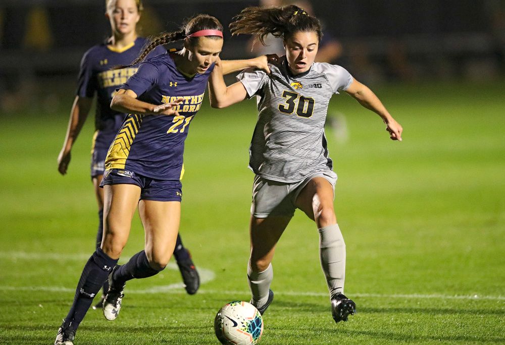Iowa forward Devin Burns (30) battles for position on the ball during the second half of their match at the Iowa Soccer Complex in Iowa City on Friday, Sep 13, 2019. (Stephen Mally/hawkeyesports.com)