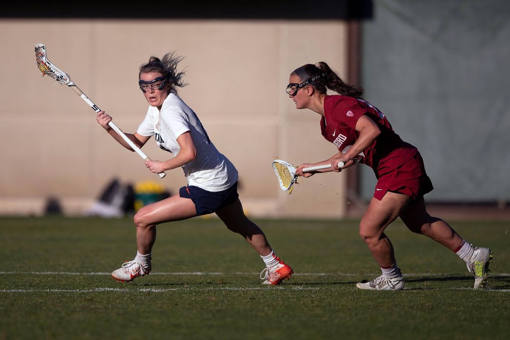 STANFORD, California - FEBRUARY 14: Virginia Cavaliers midfield Courtlynne Caskin (25) is deafened by Stanford Cardinal defense Maggie Bellaschi (11) during the second half at Cagan Stadium on February 14, 2020 in Stanford, California. The Virginia Cavaliers defeated the Stanford Cardinal 12-11. (Photo by Jason O. Watson)